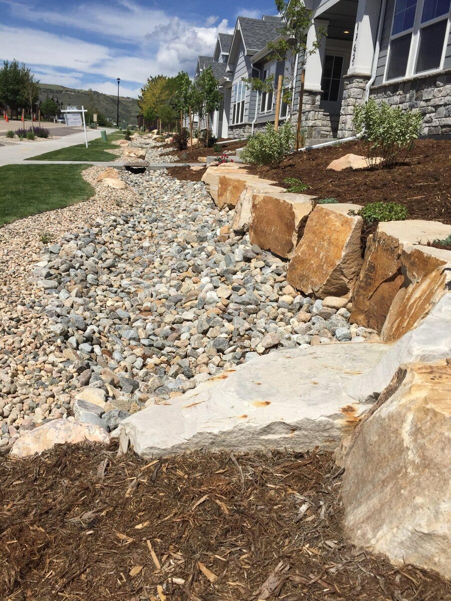 Commercial property dry creek drainage channel by Brooks Landscape