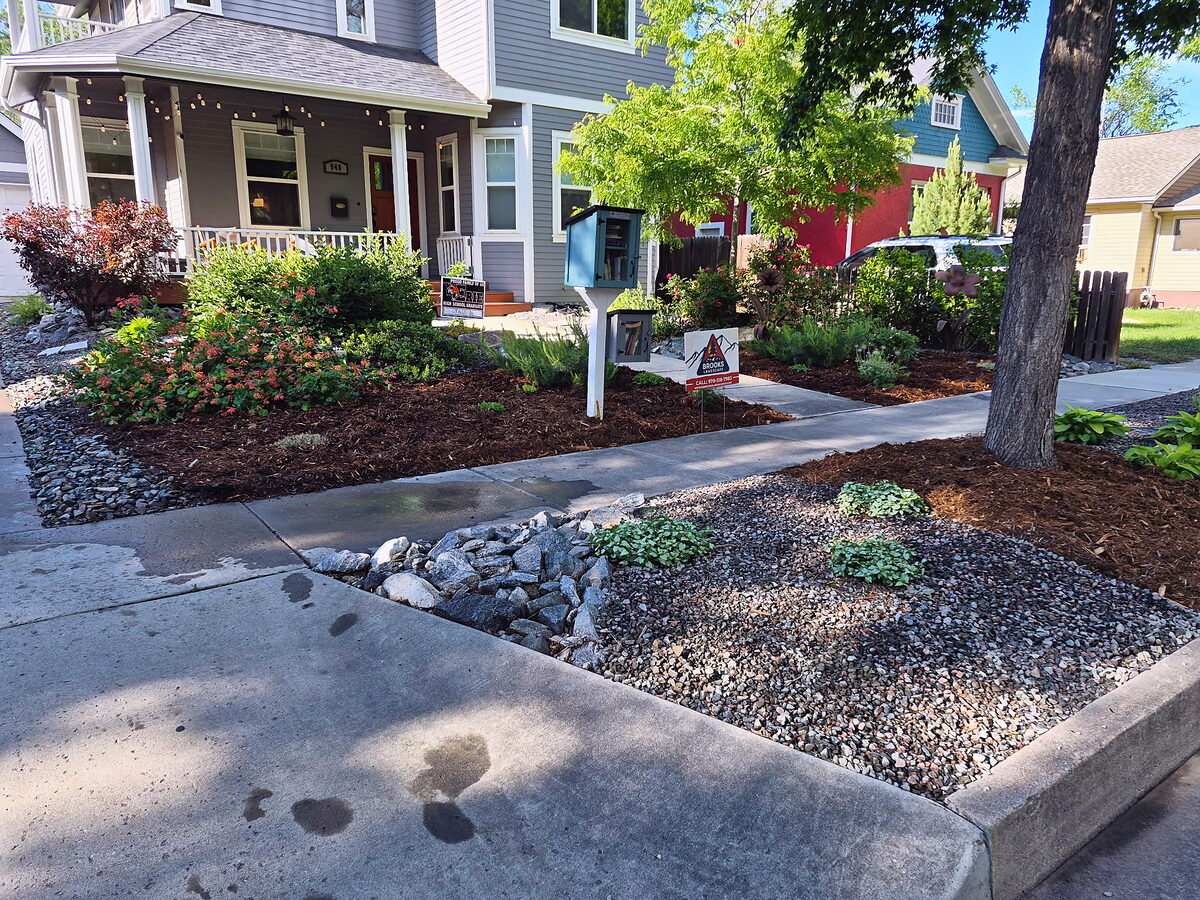 Front yard dry creek bed for drainage built by Brooks Landscape