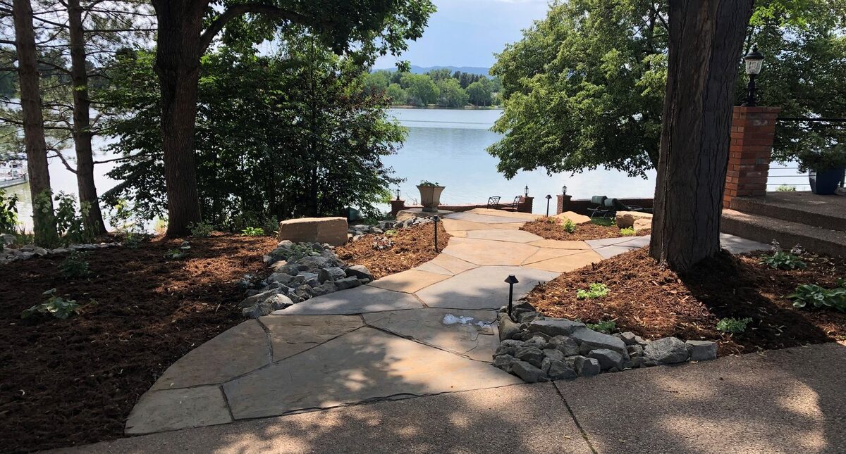 Lakefront flagstone patio and path by Brooks Landscape