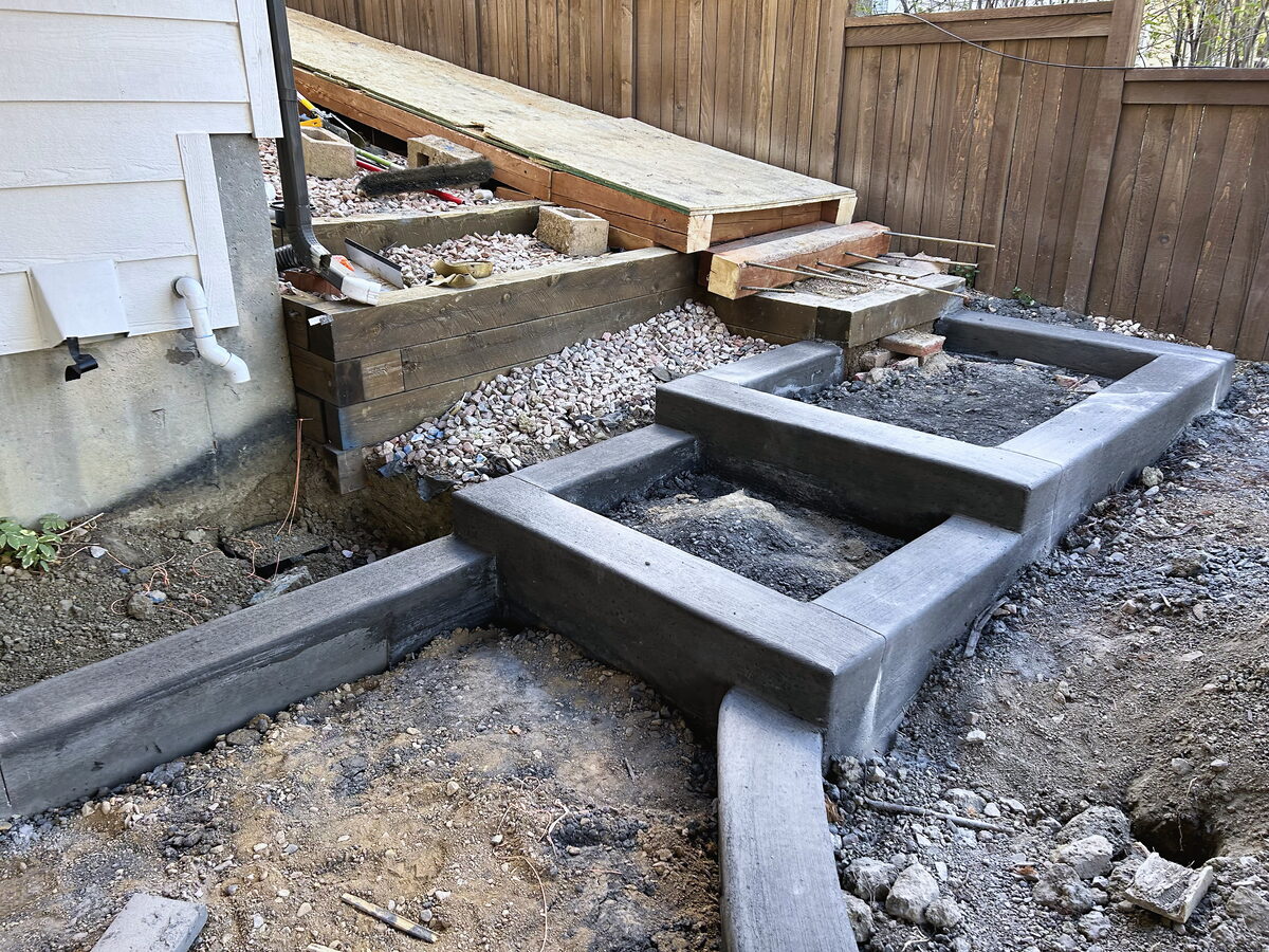 Retaining and drainage wall under construction by Brooks Landscape