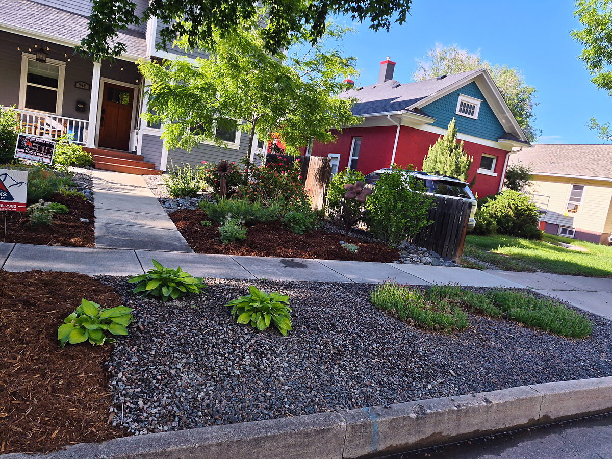 Water-wise front yard landscape with mulch beds and perennials by Brooks Landscape